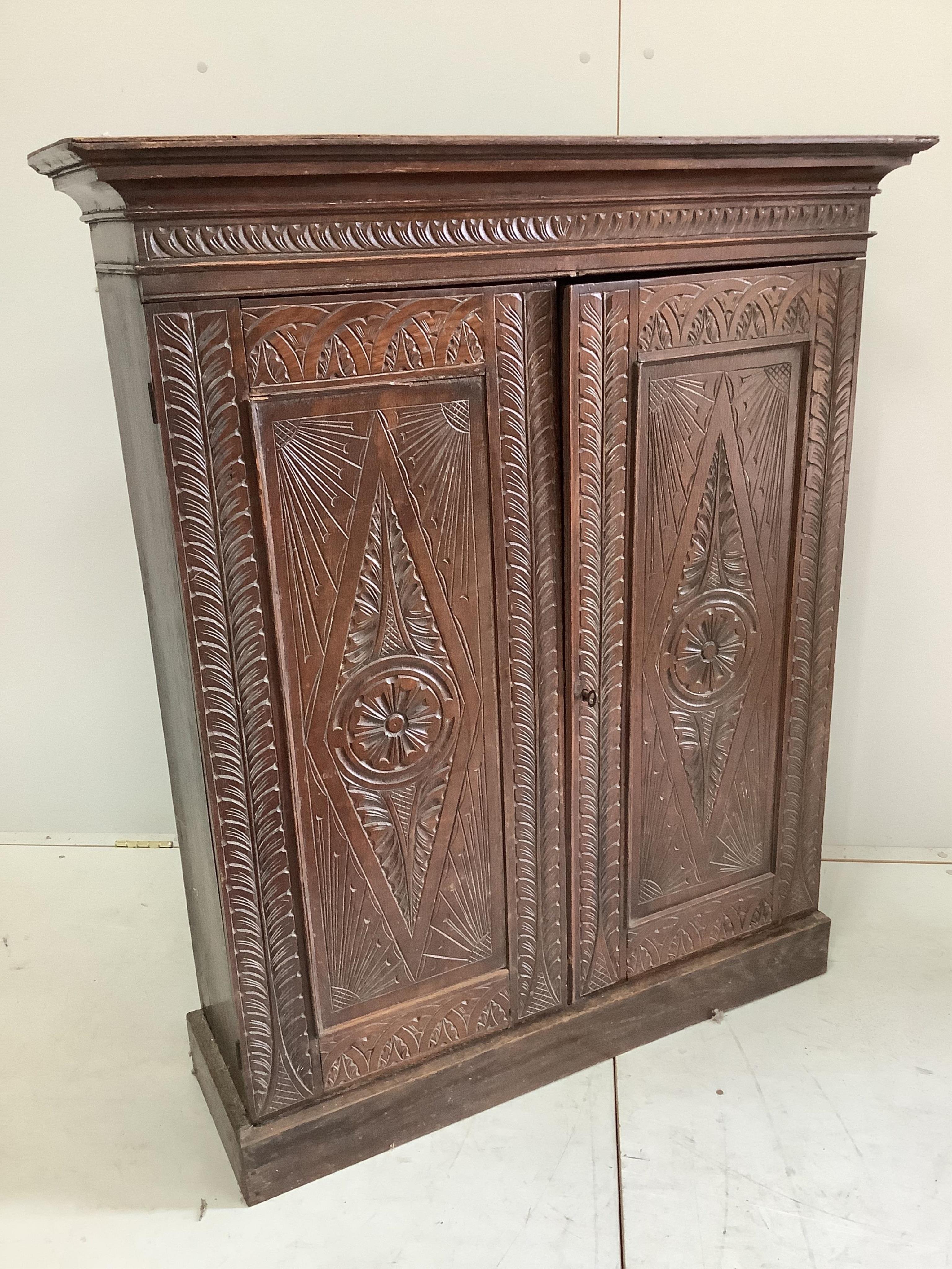 A Victorian carved oak side cabinet, width 99cm, depth 31cm, height 119cm. Condition - fair